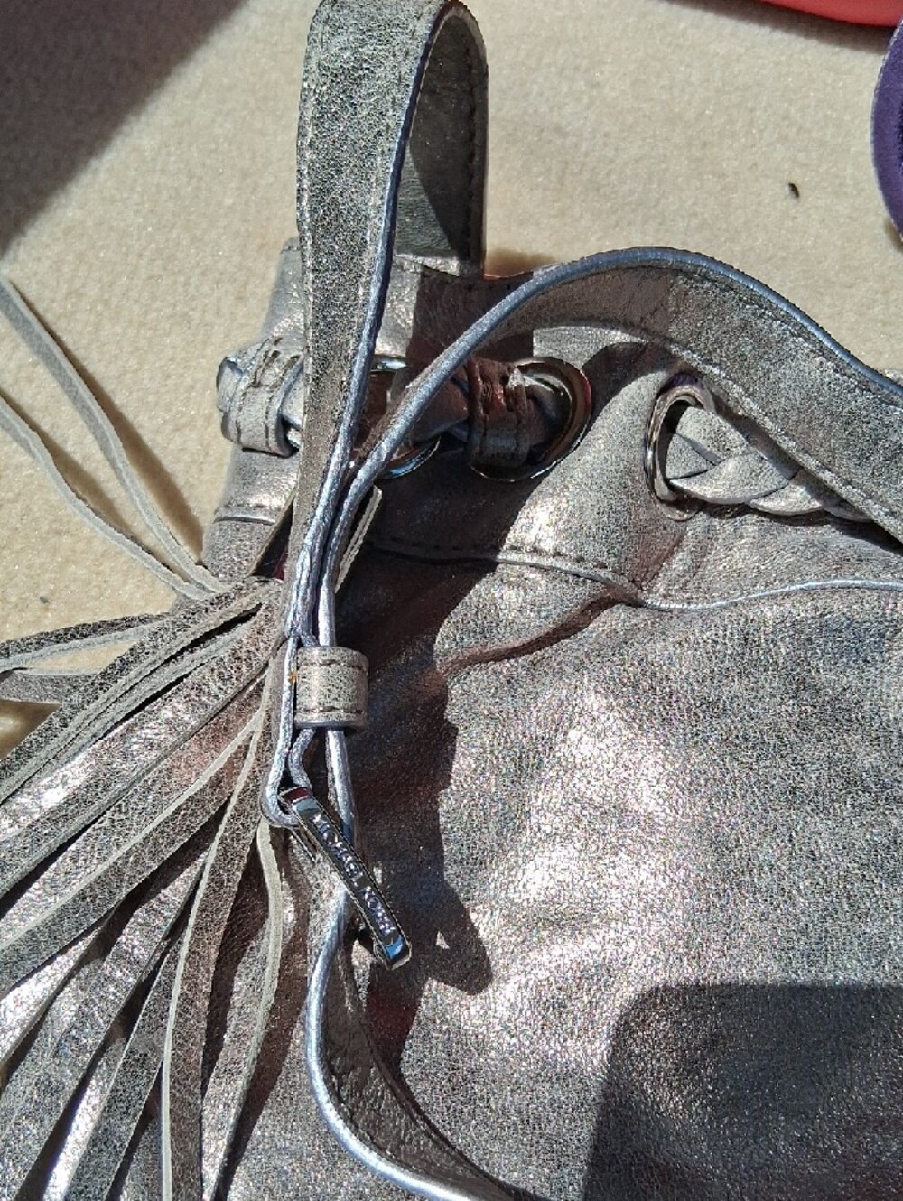 Michael Kors Metallic Pewter Tassel Drawstring Crossbody - Picture 7 of 12
